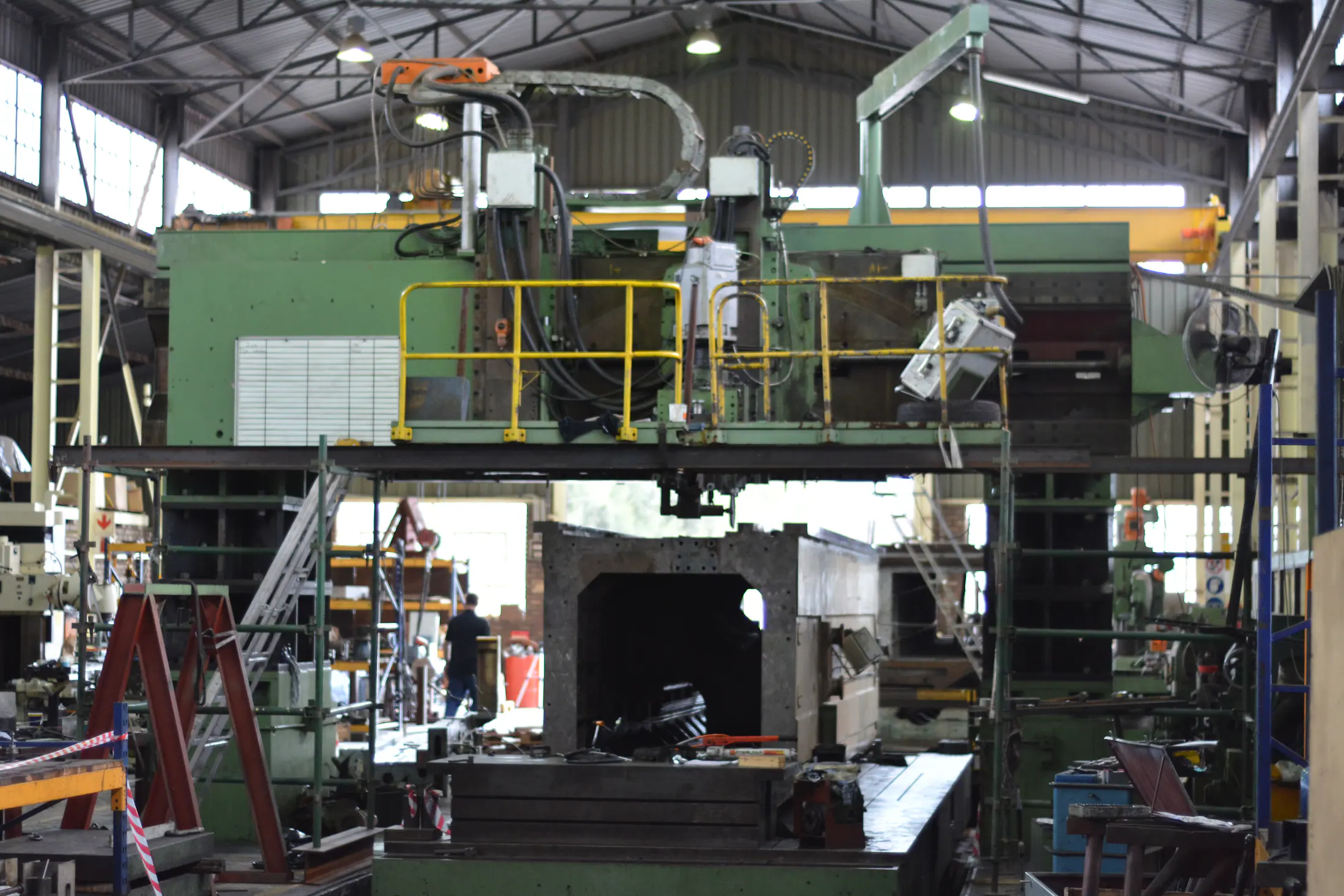Large industrial machine tool inside a heavy engineering workshop